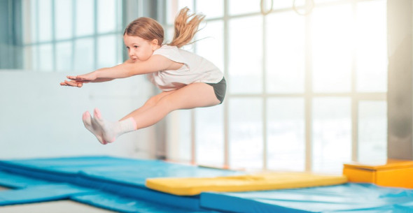 Trampolining girl mid-jump